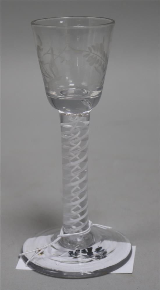 A wine glass, c.1770, with bucket bowl etched with floral sprigs, multi series opaque twist stem, 5.5in.